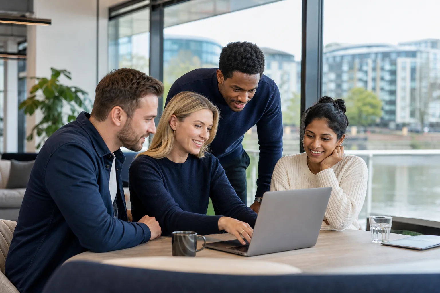 Consultancy and technology team collaborating in a Maidenhead riverside workspace