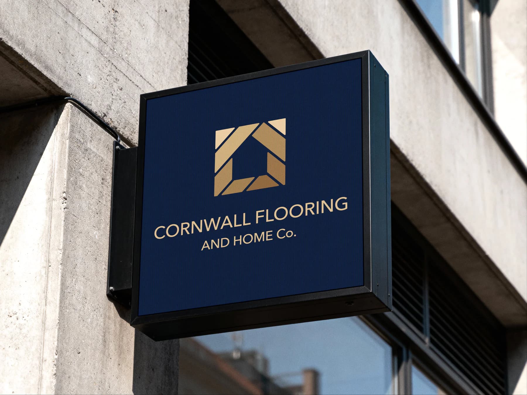 Cornwall Flooring and Home Co. navy and gold logo applied to an exterior business sign