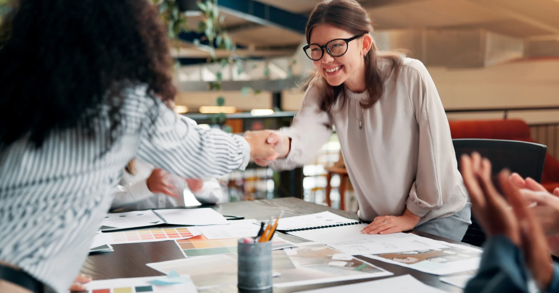 A well-structured design brief document next to creative design outputs